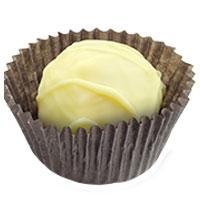 Chocolate Tales White Chocolate Truffle. Circular white chocolate wrapped elegantly in brown wrapping.