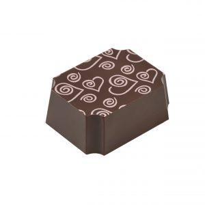 Raspberry filled chocolate truffles from Chocolate Tales. A square shaped truffle with heart shaped designs.